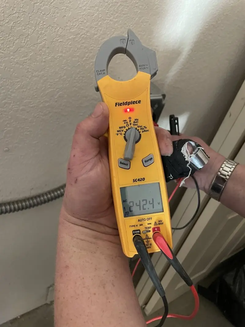 Voltage testing with clamp meter during Electrical Installation Services in Eloy